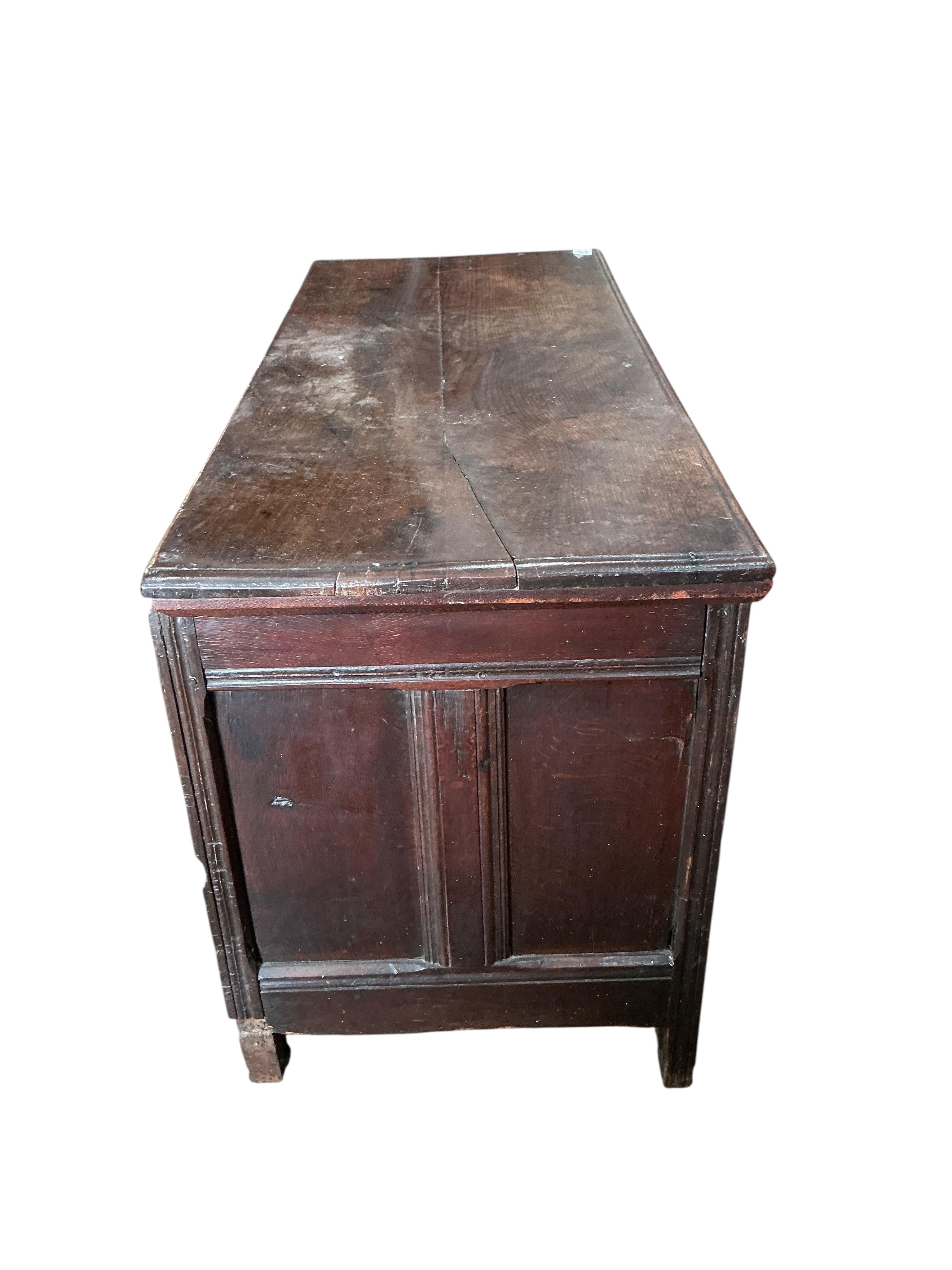 A 17th century carved oak coffer, width 126cm, depth 53cm, height 72cm